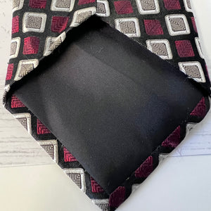 Black fabric on a patterned fabric surface
