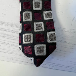Patterned tie on a textured white background