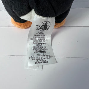 Close-up of a Disney label on a plush toy with a white background