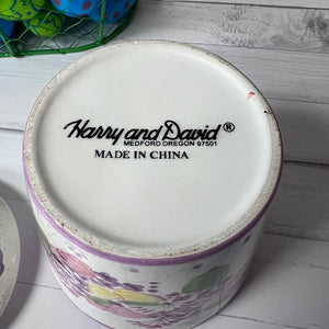 Ceramic container with 'Harry and David' branding on a wooden surface