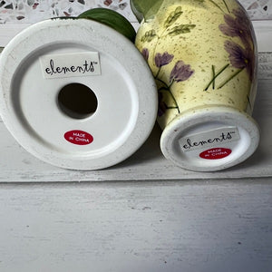 Two decorative items with 'elements' branding on a white surface.