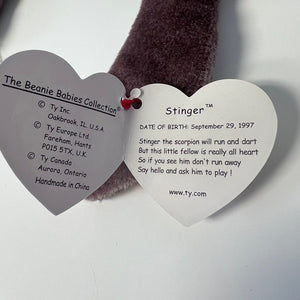 Heart-shaped tag from a Ty Beanie Baby named Stinger on a white background