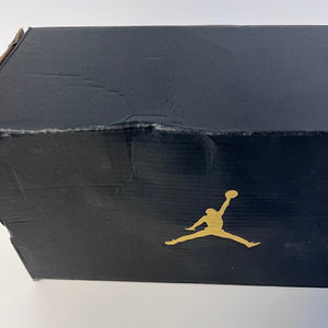 Black shoe box with gold Jordan logo on a white background