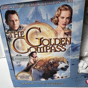 Movie DVD cover for 'The Golden Compass' featuring two characters and a compass.