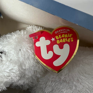 Ty Beanie Babies heart-shaped tag on a white fluffy surface