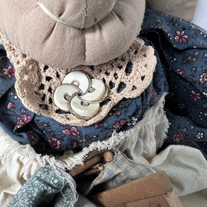 Close-up of a textured fabric with buttons and floral patterns