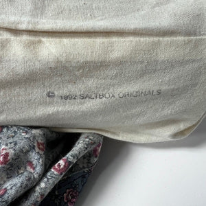 Close-up of a muslin fabric with '1992 Salbox Originals' branding on a white background.