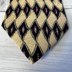 Patterned tie on a light wooden surface