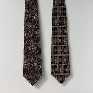 Two patterned ties on a light gray background