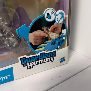 Box of 'Guardians of Harmony' toy set with a child playing with a figurine.