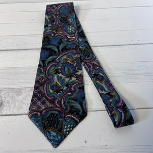 Patterned tie on a light wooden surface