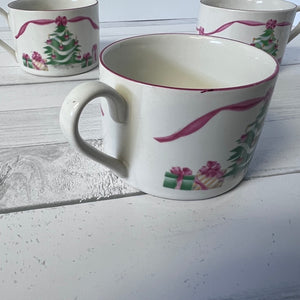 Ceramic mug with decorative design on a white surface