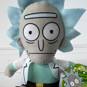 Plush toy resembling a character with light blue spiky hair and a green shirt on a white background