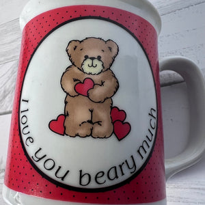 Mug with teddy bear and heart design, text 'I love you beary much', on a white background