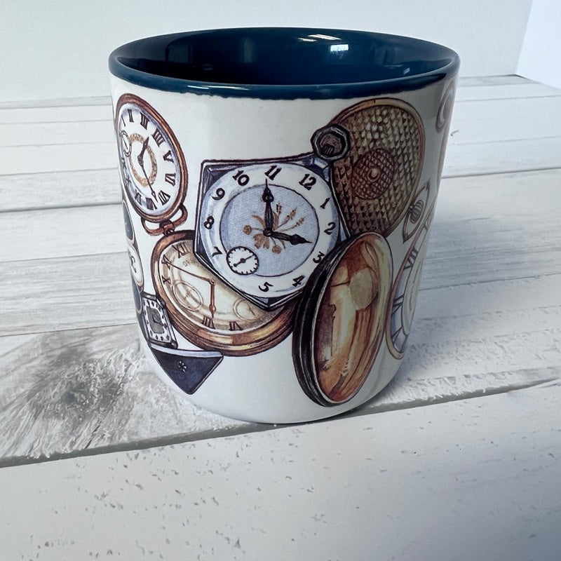 Ceramic mug with clock design on a wooden surface
