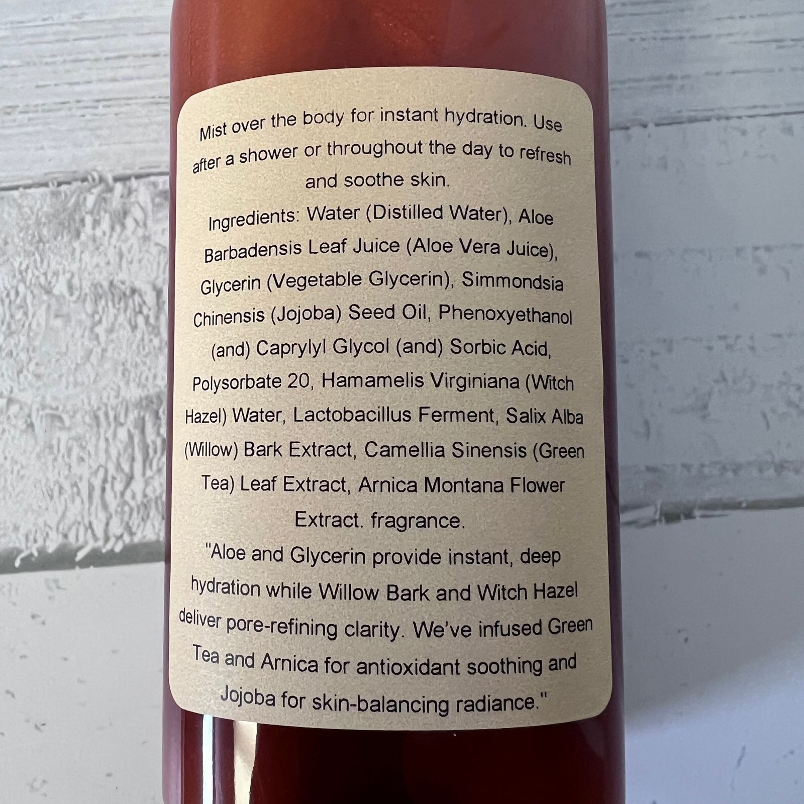 Bottle label with product information on a textured white background