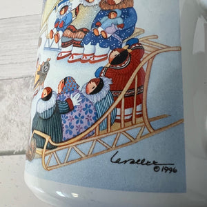 Ceramic mug with a winter scene illustration of people on a sled, featuring a signature and year.