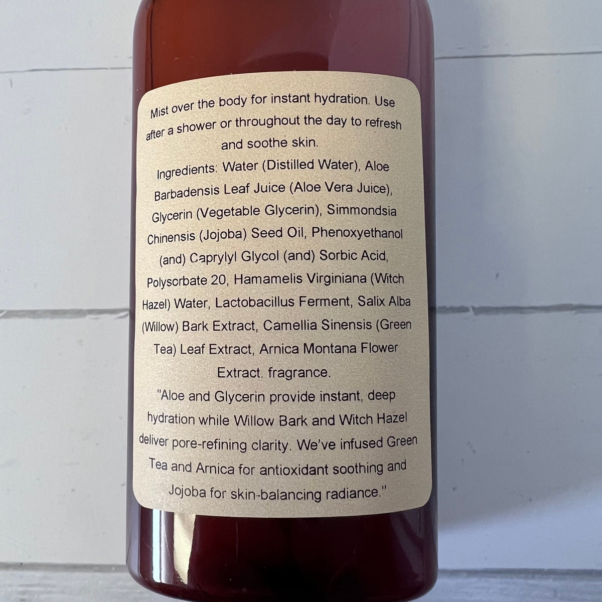 Bottle label with product description and ingredients on a white background