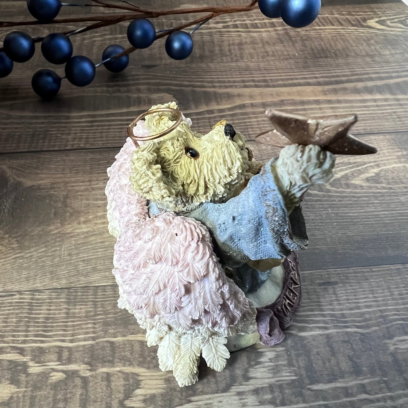Decorative bear piece with a star on a wooden surface