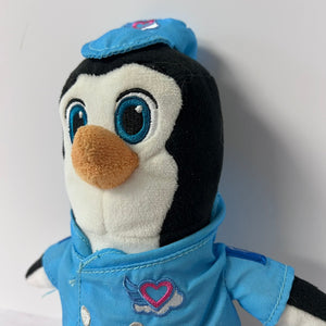 Plush penguin toy wearing a blue outfit with a heart emblem on a white background