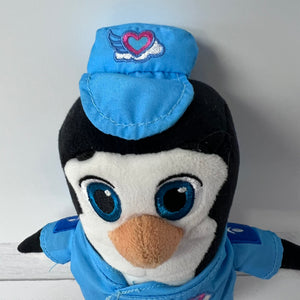 Plush penguin toy wearing a blue outfit with a heart emblem on a white background