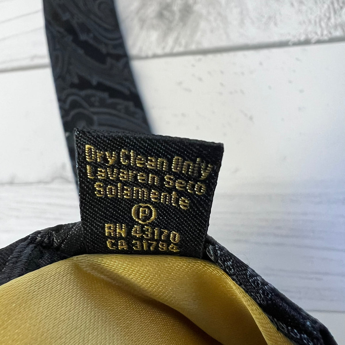 Clothing label with text on a textured surface