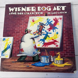 Book cover of 'Wiener Dog Art' by Gary Larson featuring a cartoon character painting.