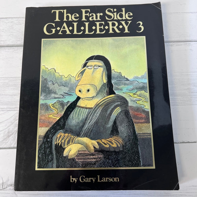 Book titled 'The Far Side Gallery 3' by Gary Larson on a wooden surface