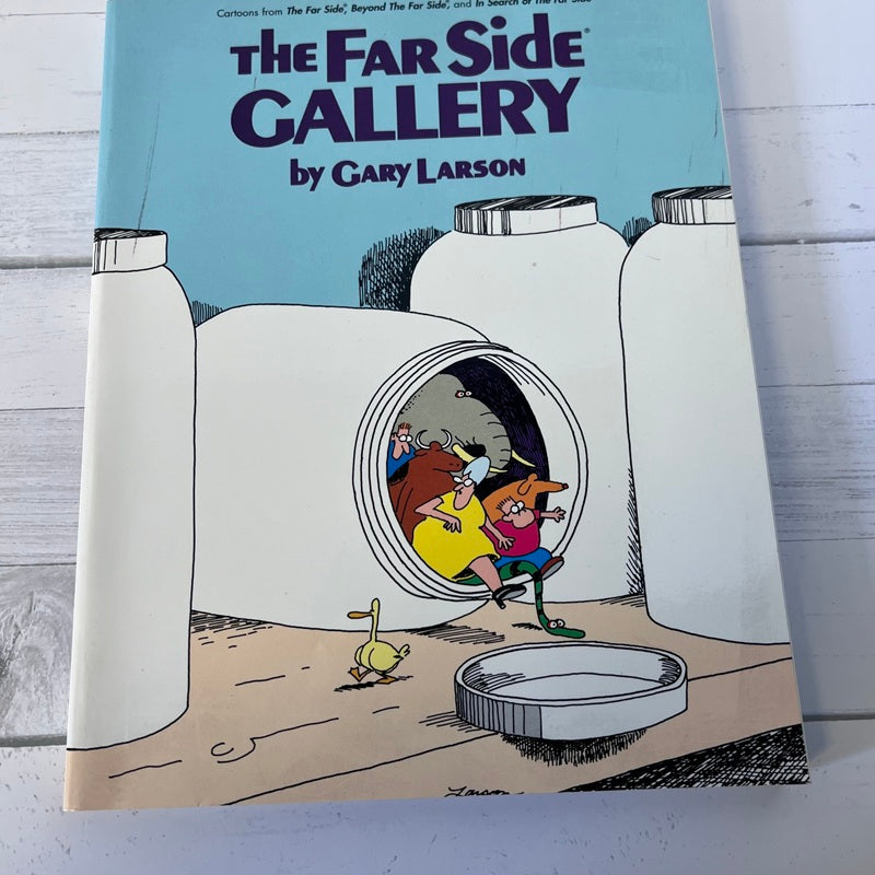 Book titled 'The Far Side Gallery by Gary Larson' with a cartoon cover showing two characters exiting a tube.