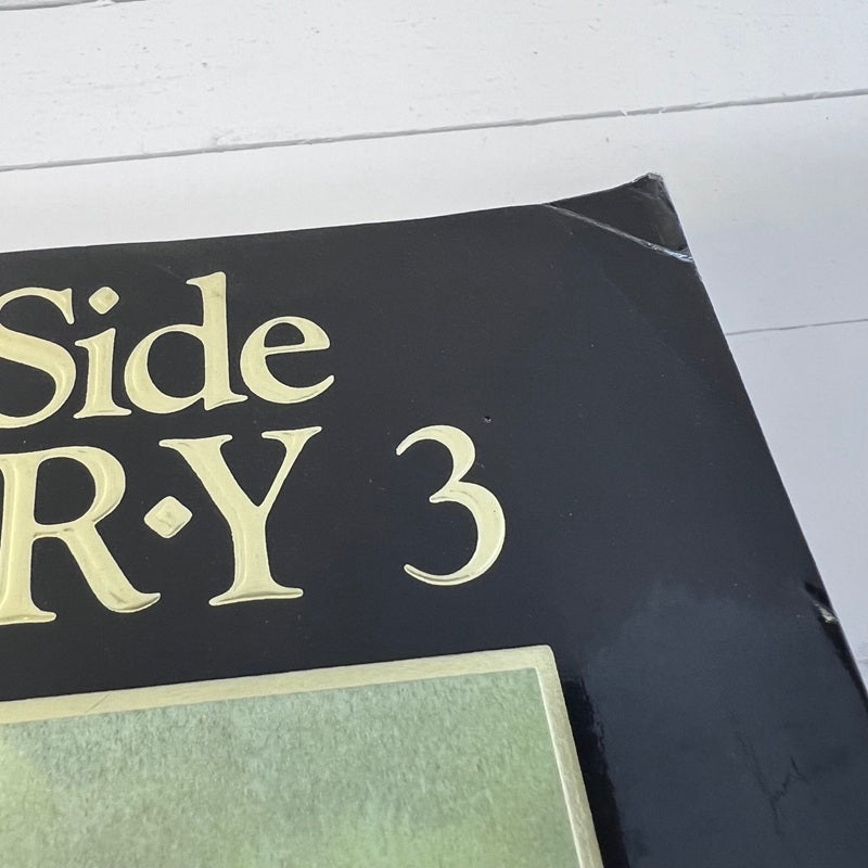 Book titled 'Side R-Y 3' on a white surface