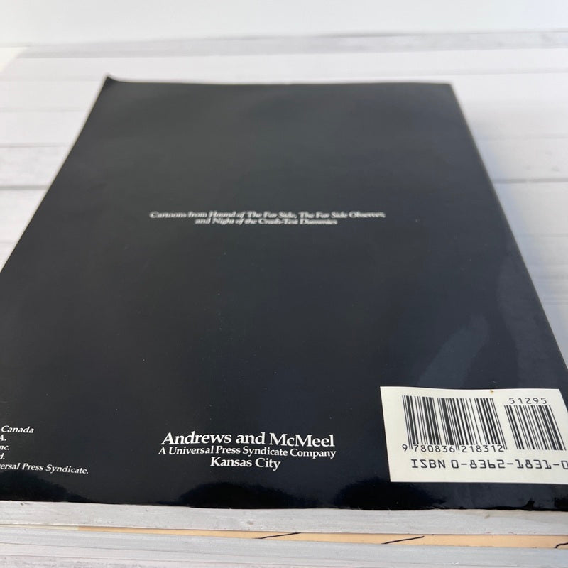 Back cover of a book with text and a barcode on a light wooden surface