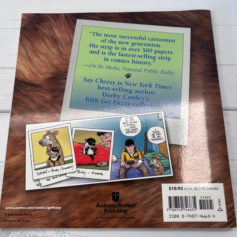 Book cover with cartoon illustrations and text on a wooden surface