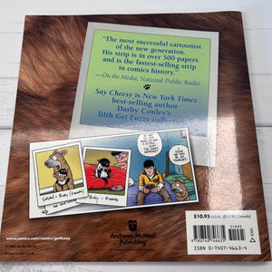 Book cover with cartoon illustrations and text on a wooden surface