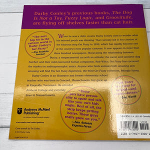 Back cover of a book with text and branding on a wooden surface