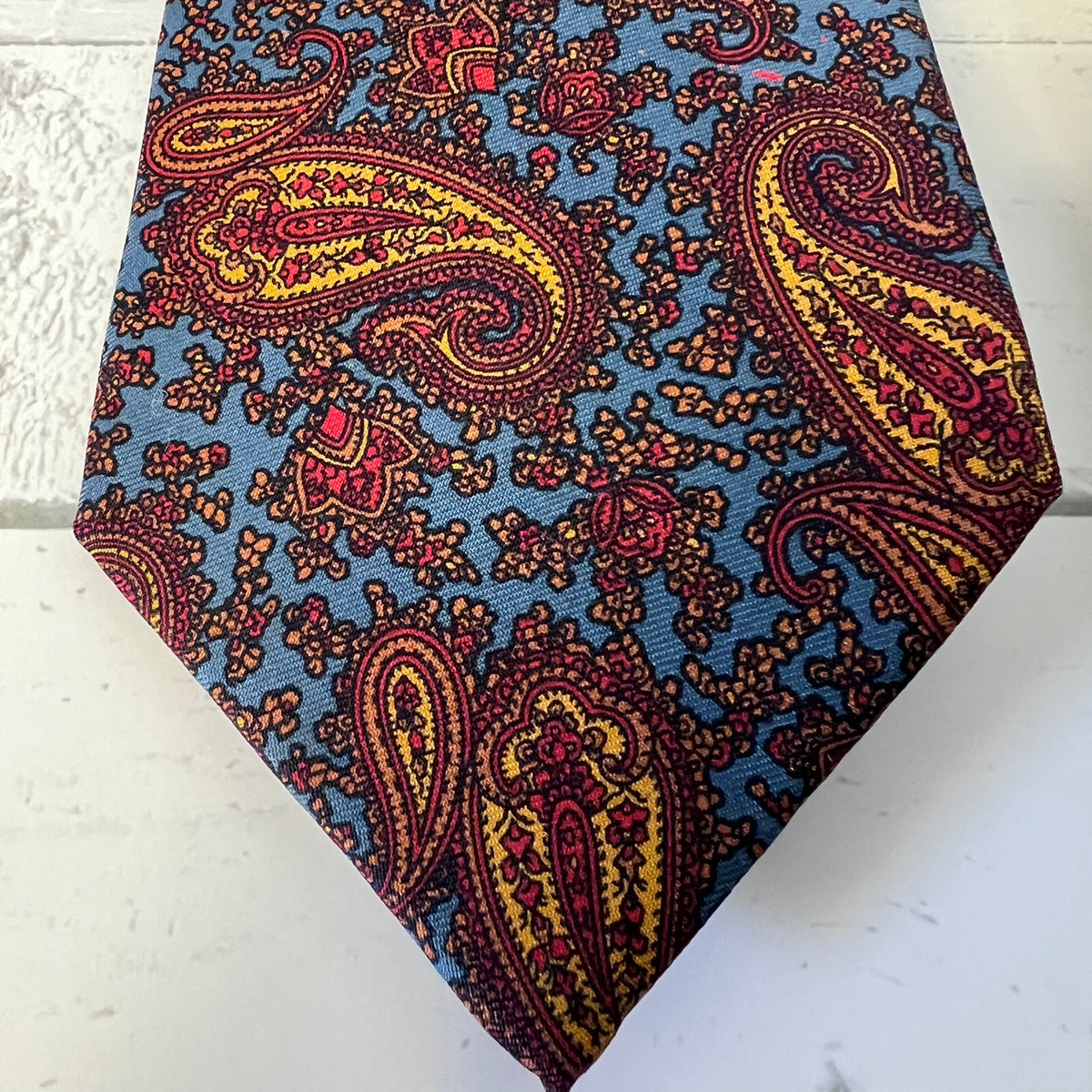 Paisley patterned tie on a white background