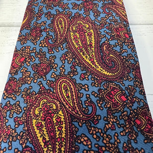 Paisley patterned fabric with blue background