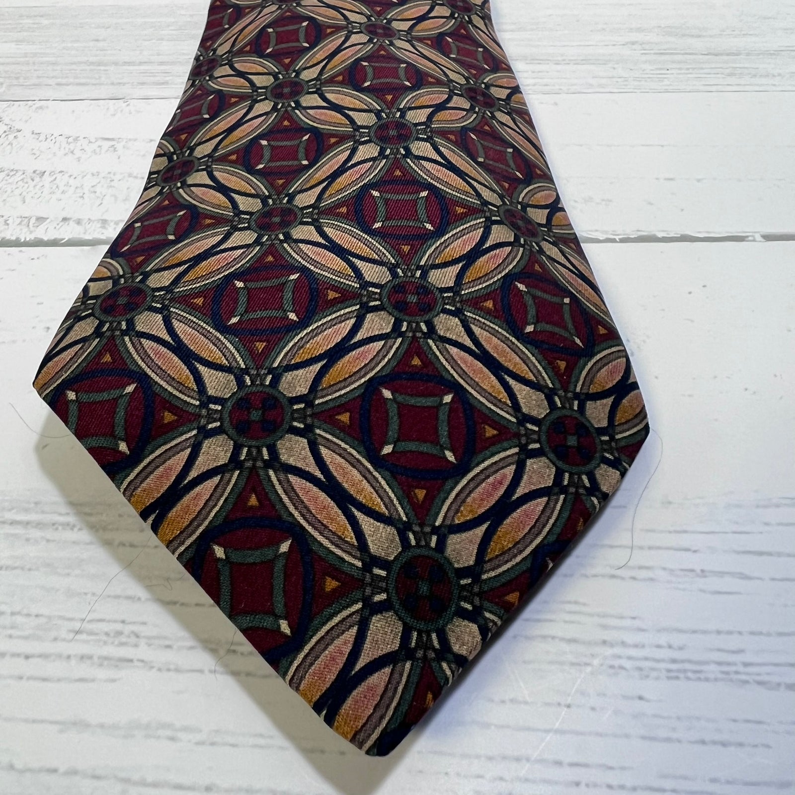 Patterned tie on a light wooden surface