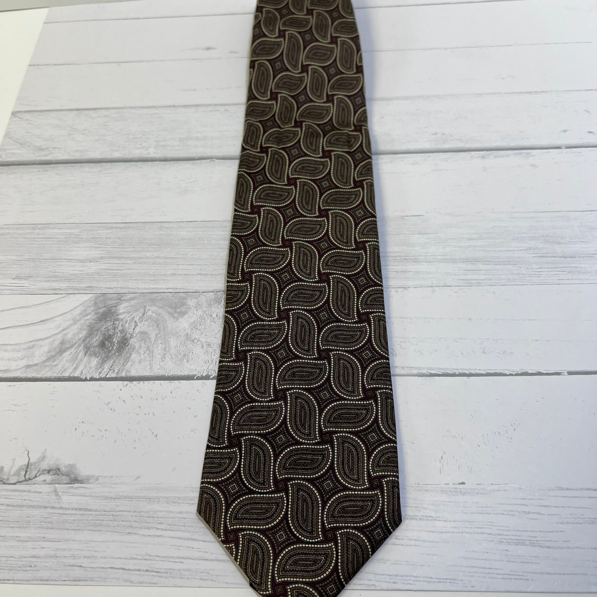 Patterned tie on a wooden surface