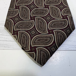 Patterned tie on a light wooden surface