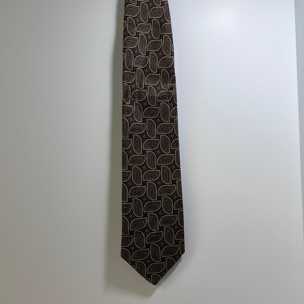 Black patterned tie on a white background