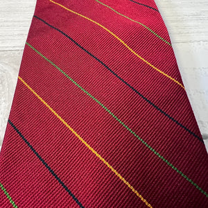 Red tie with diagonal stripes on a white background