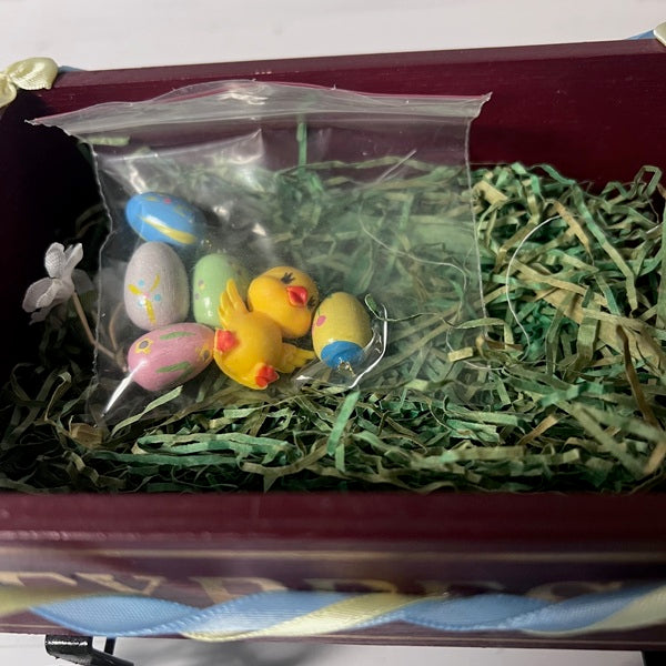red wagon with easter chick and eggs