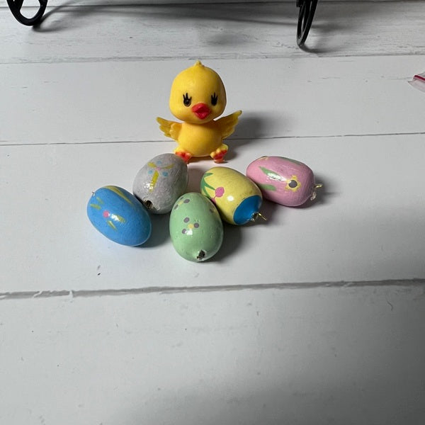 miniature easter chick and easter eggs