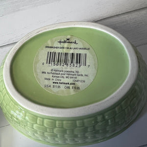 Green ceramic item with a Hallmark label on a white background