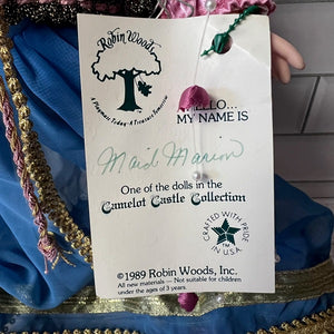 Tag from a Robin Woods doll with text and branding