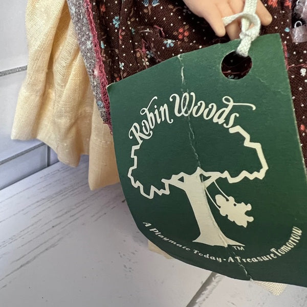 Green tag with 'Robin Woods' branding on a toy background