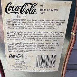 Coca-Cola brand label on a metal can with text and barcode