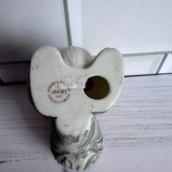 Decorative item with 'Avon' branding on a white background