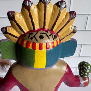Colorful Native American headdress figurine on a white background