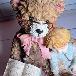 Teddy bear with decorative elements on a wooden surface